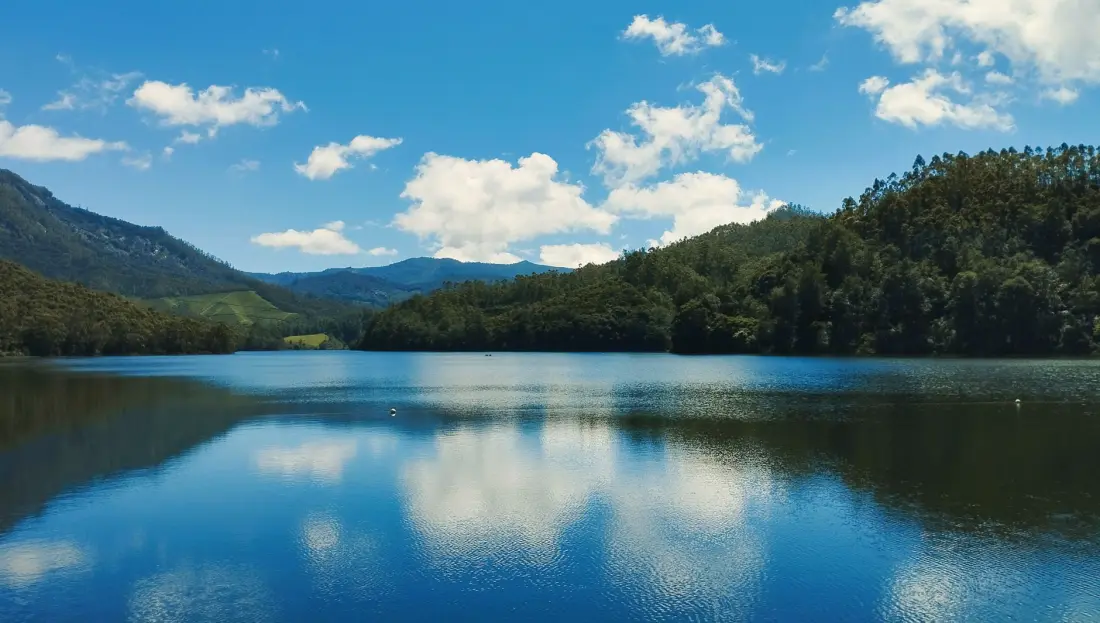 Mattupetty Dam lake ringed by forest, Munnar